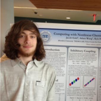 Jacob Gold standing in front of his poster.