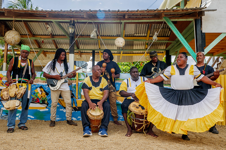 The musicians of the Garifuna Collective perform outdoors