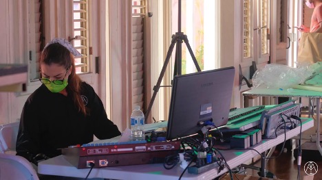 Camila Perez Vasquez sits at the lighting board