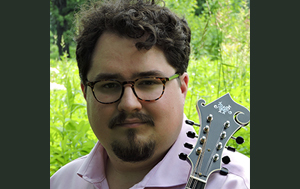 Taylor Ackley plays the guitar