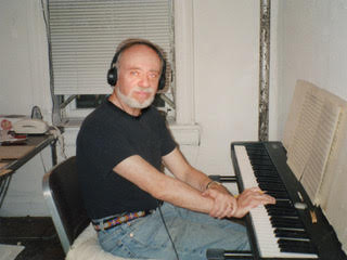 Martin Boykan sits at the keyboard with headphones