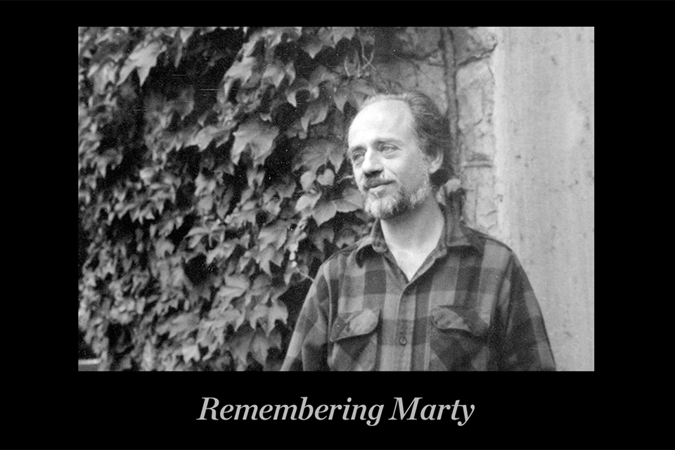 A portrait of Marty Boykan with the text "Remembering Marty" below it