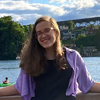 Hannah Gudeman poses by the water