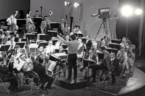 Henri Lazarof conducts an orchestra