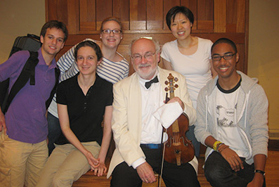 Dan Stepner with a violin workshop students