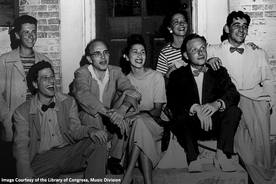 A group of composers and friends pose on the steps outside of a building in 1946