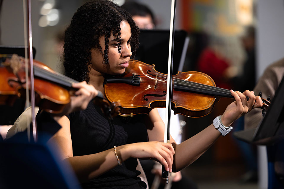 Student playing the violin