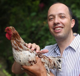 Guy Sharett holding a chicken