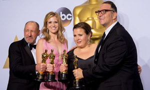 Michael Sugar and the 'Spotlight' team holding their Academy Awards for Best Picture