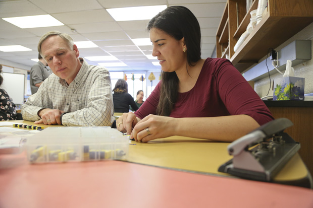 Anna Hartmann with teacher working with kit.