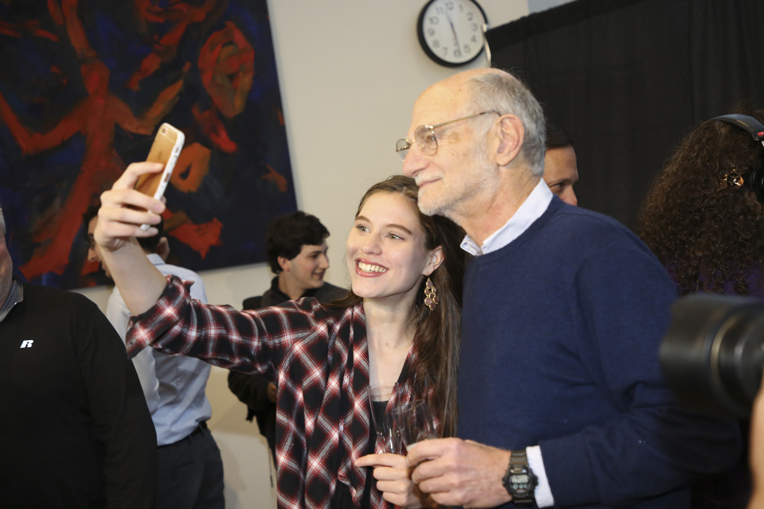 michael rosbash takes a selfie with a student