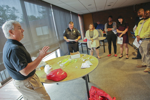 Dr. Dan Muse from Brockton Hospital instructs area coordinators and others in the use of overdose reversal drug naloxone at a training on Spet. 22, 2017.