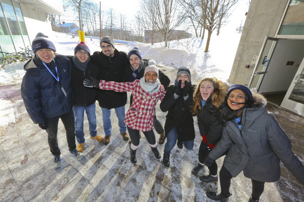 A group of smiling students pose for a photo