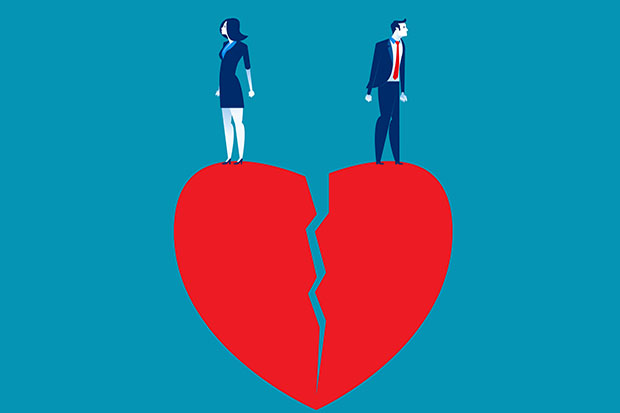 Broken heart with man and woman on either half.
