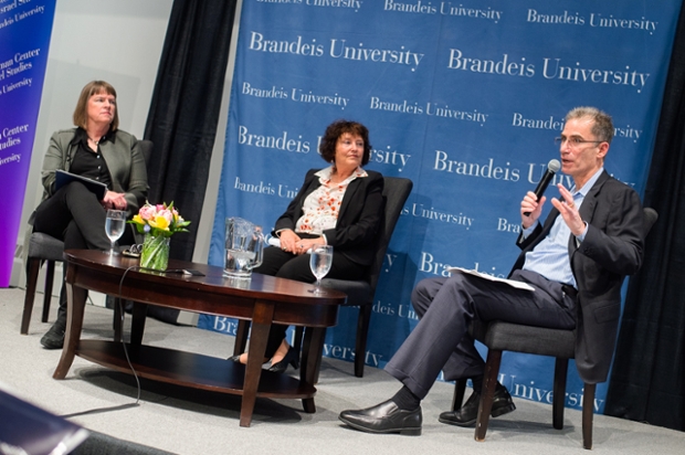 left to right: Provost Lisa M. Lynch, former Israel Central Bank president Karnit Flug, and (with microphone) Gideon Argov, general partner at New Era Capital Partners seated in front of a Brandeis University banner
