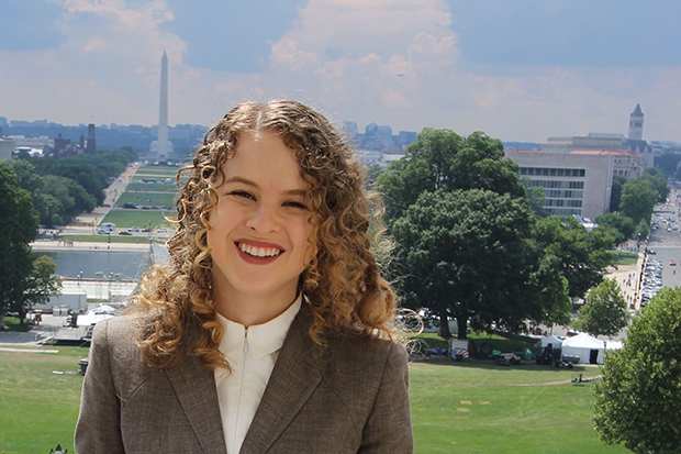 Troia Reyes-Stone stands in front of the Washington Monument