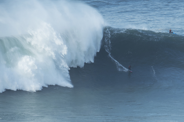 Russian surfer Sergey Mysovskiy surfing big wave in Nazare Portugal