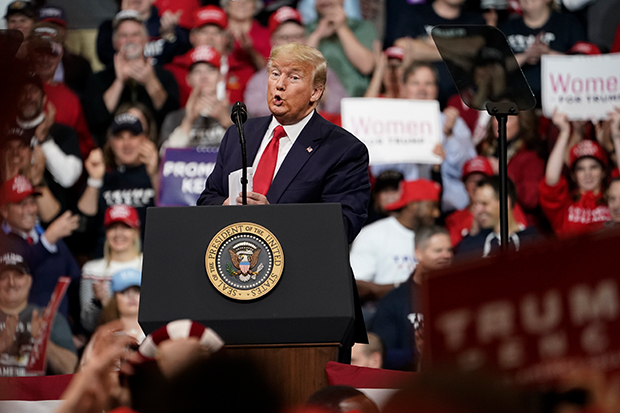 Donald Trump speaks to a crowd at a rally.