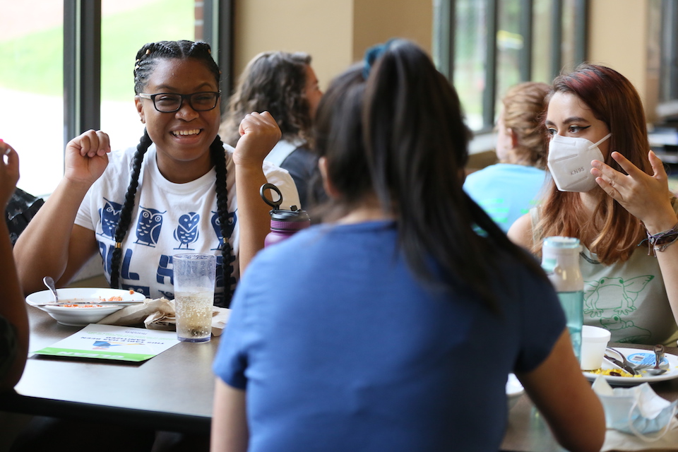 Students chat while dining