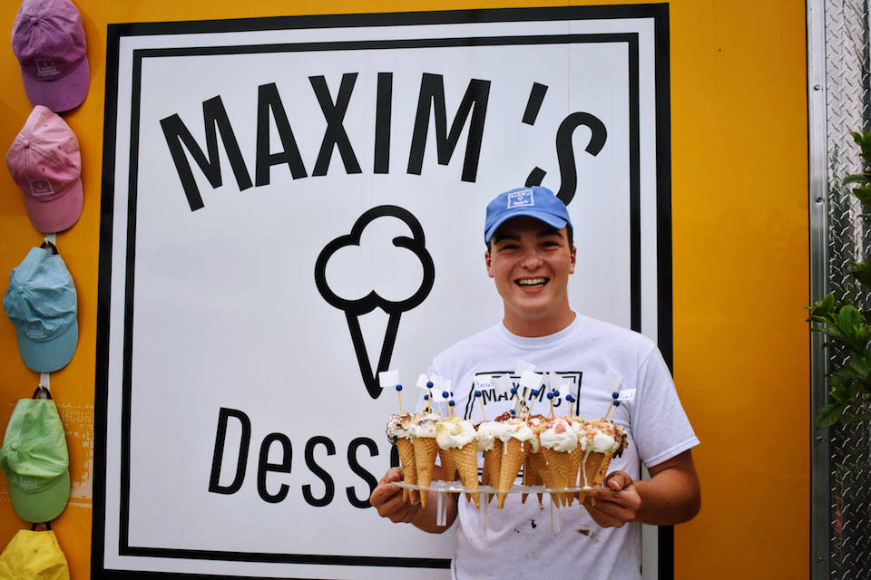Max LeBlanc holds pie cones outside his food truck