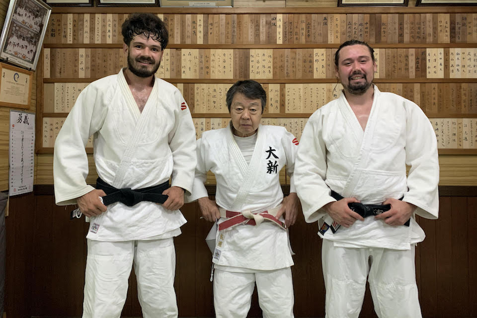 Ben Percival (left) with his brother, and fellow Brandeis grad, Iosefa Percival ’16 (right), who is his Olympic coach, and their judo teacher Akihiro Matsuura, 8th Dan Kodokan Judo Sensei (center).