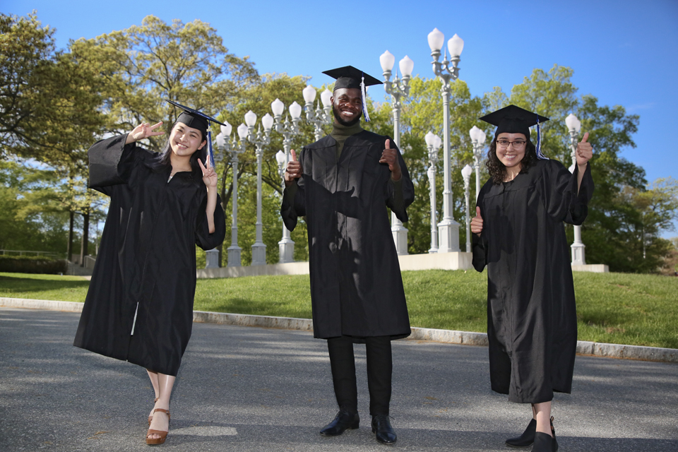 Panny Tao, Akwasi Owusu-Brempong, Nicole Berenice Zamora Flores in caps and gowns