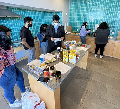 Students cook together from the Asian American Association