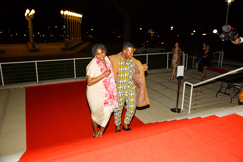 Students walk the red carpet 