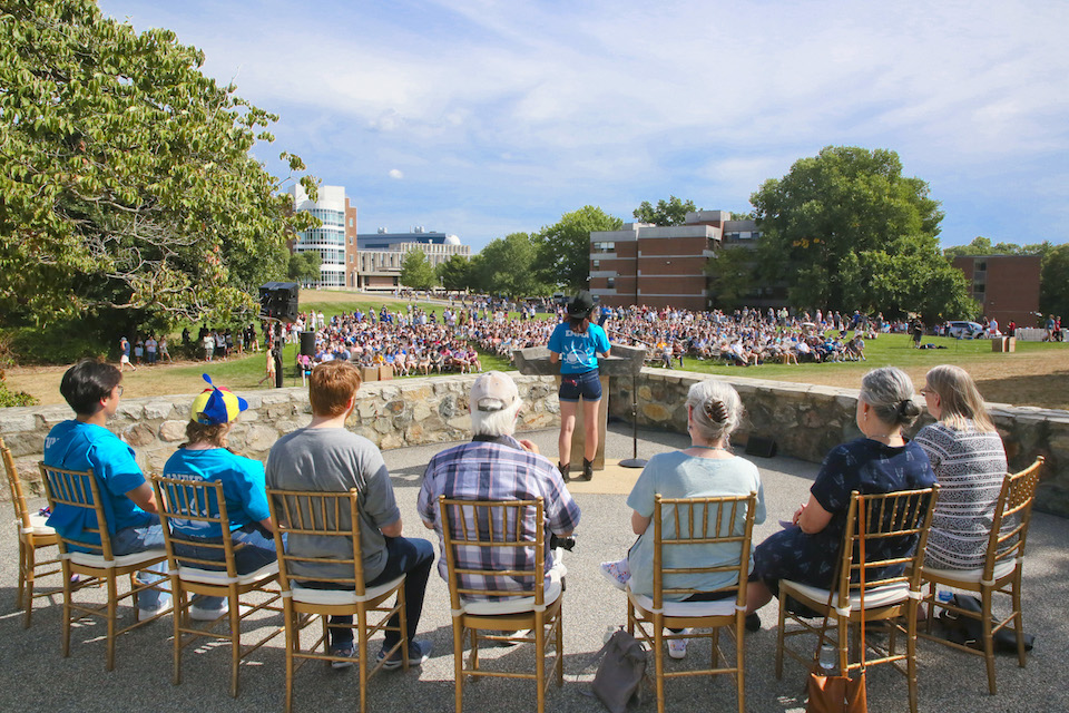 A student speaks to the crowd at Chapel's field