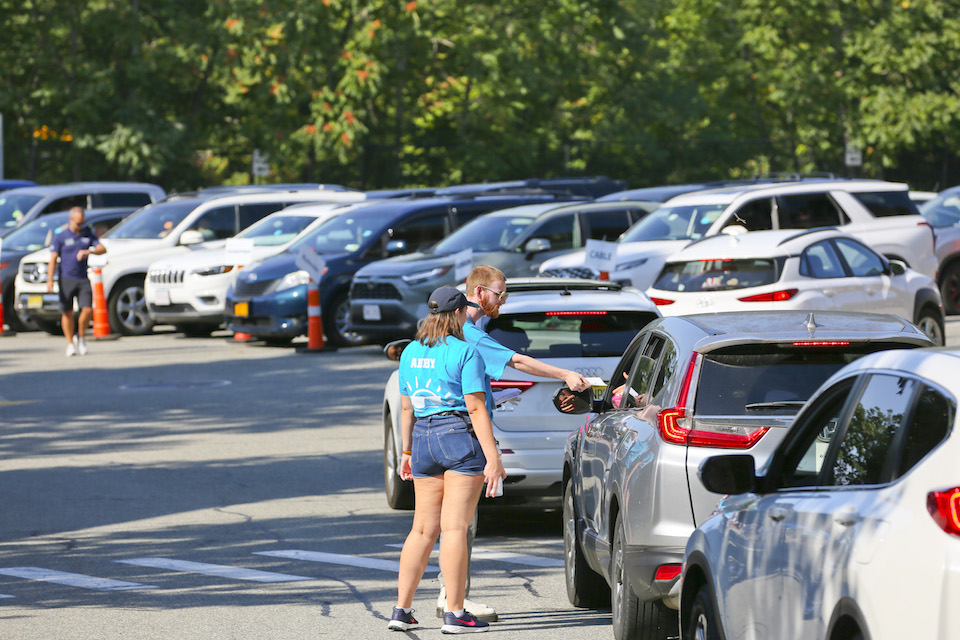 OLs greet cars arriving for orientation