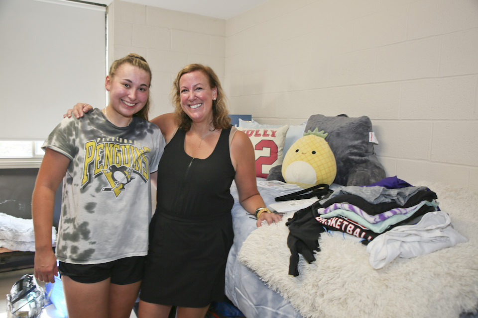 A student and her mom unpack her resident hall room