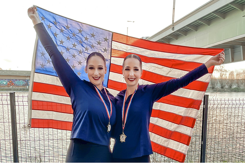 Evan Israel and Sami Winawer pose with American Flag