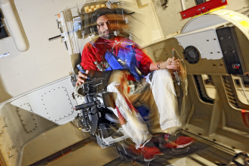 Vivekanand Pandey Vimal PhD ’17 in Brandeis' MARS space chair in photo with blurred motion
