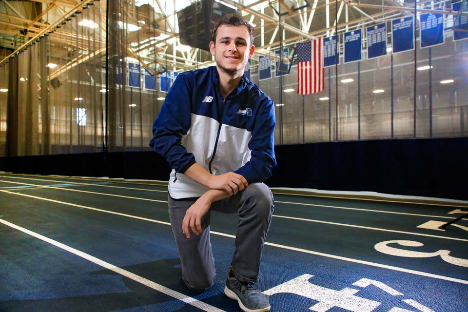 Daniel Chodorow stands on a track