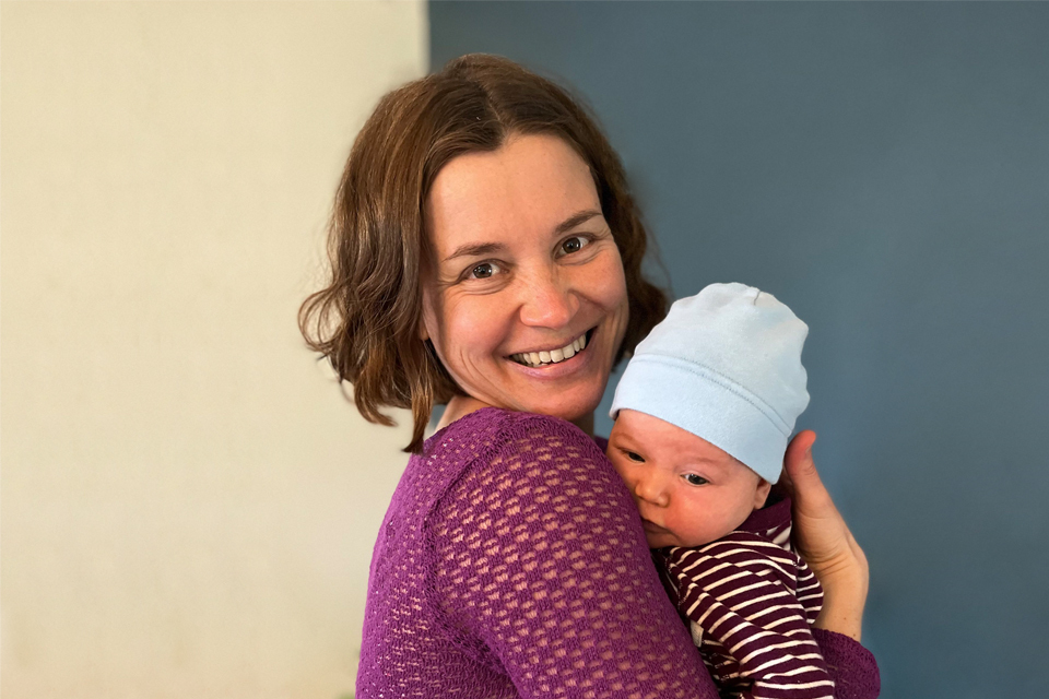 Anita Hannig poses with her newborn.