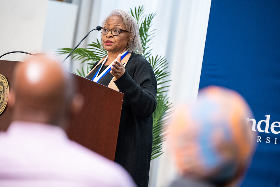 Carol Anderson delivers the Gittler Prize speech at a podium