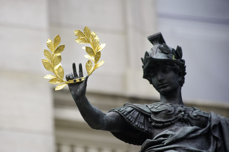 statue holds crown of laurels