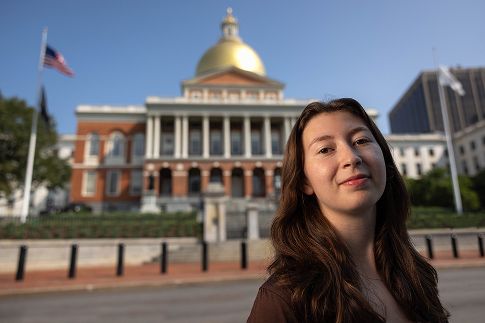 Aviva standing in front of the State House