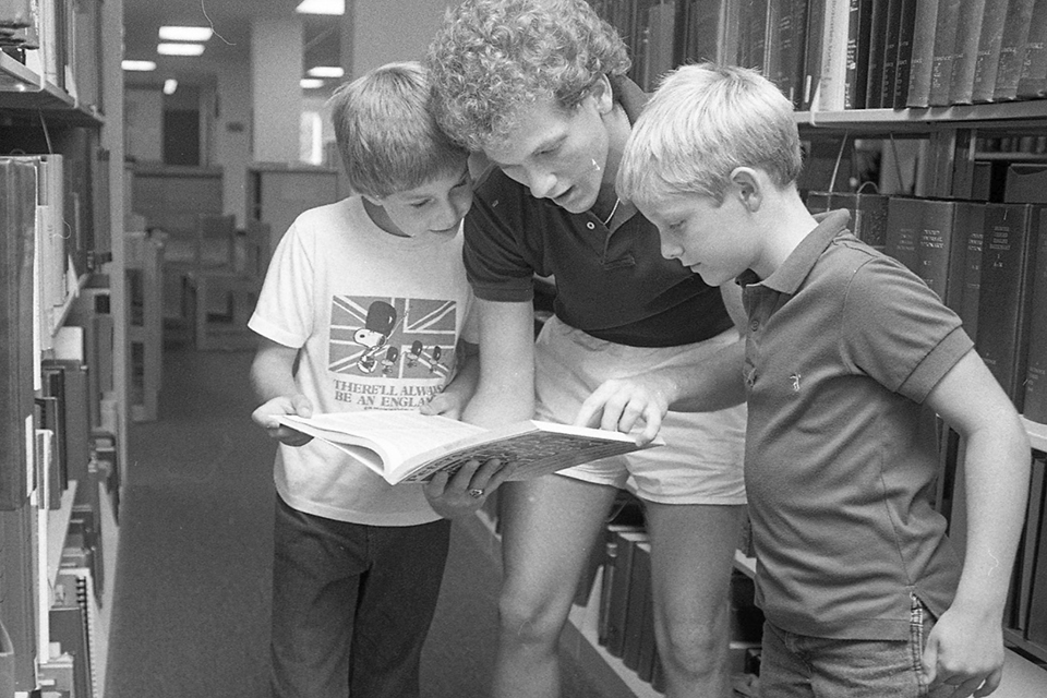 Students read with waltham group member