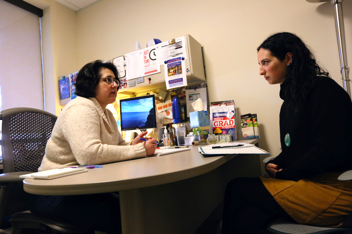 Lauren Dropkin speaks with a student