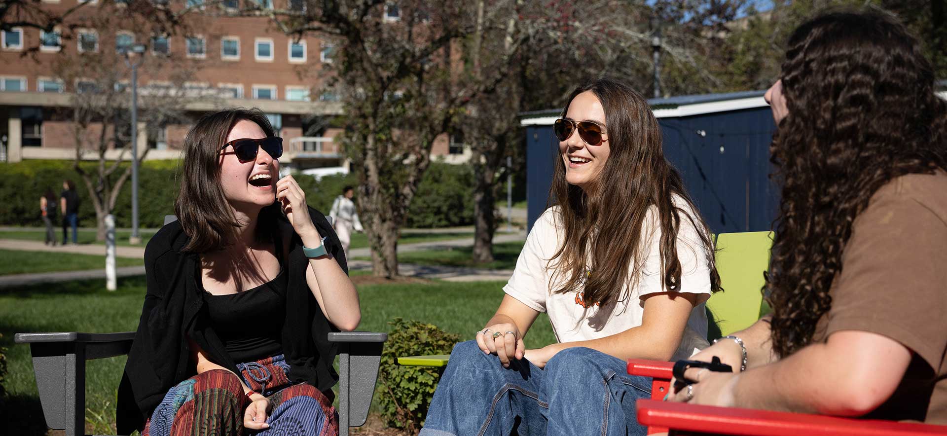 Smiling brandeis students covered in paint during the Indian celebration of Holi