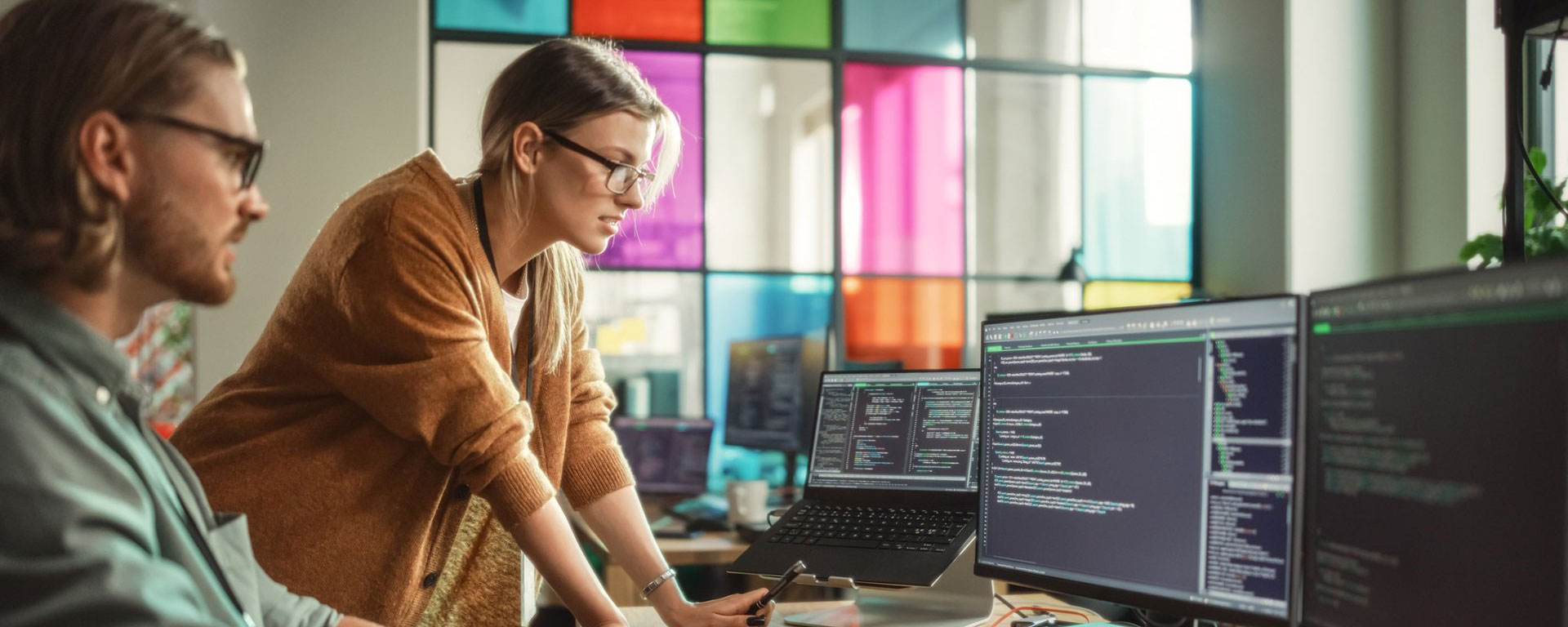 Scientists looking at a smart board