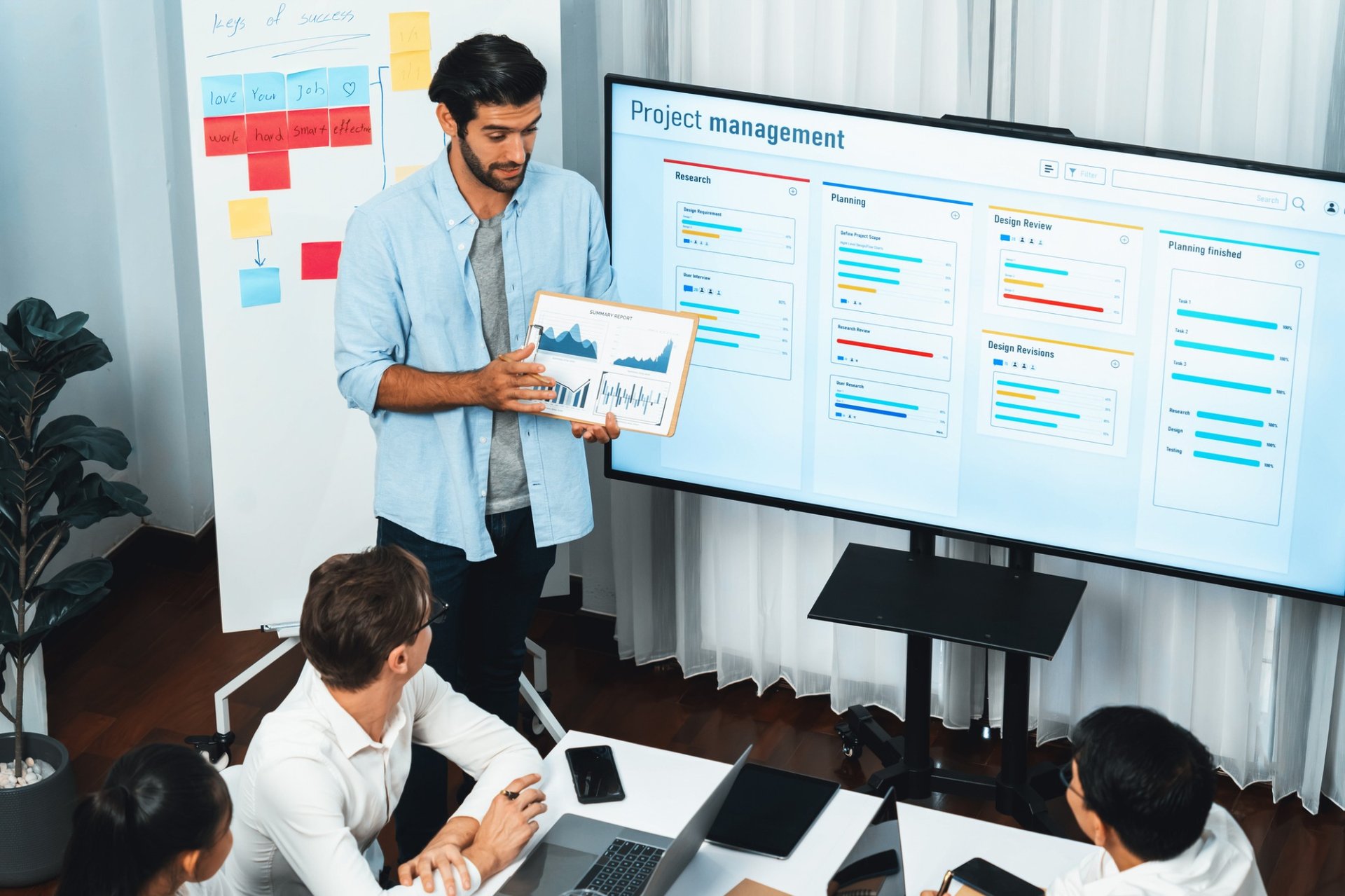Man standing in front of a group of colleagues 