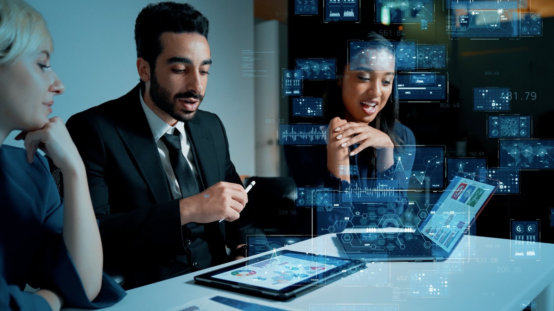 three people looking at computer screen