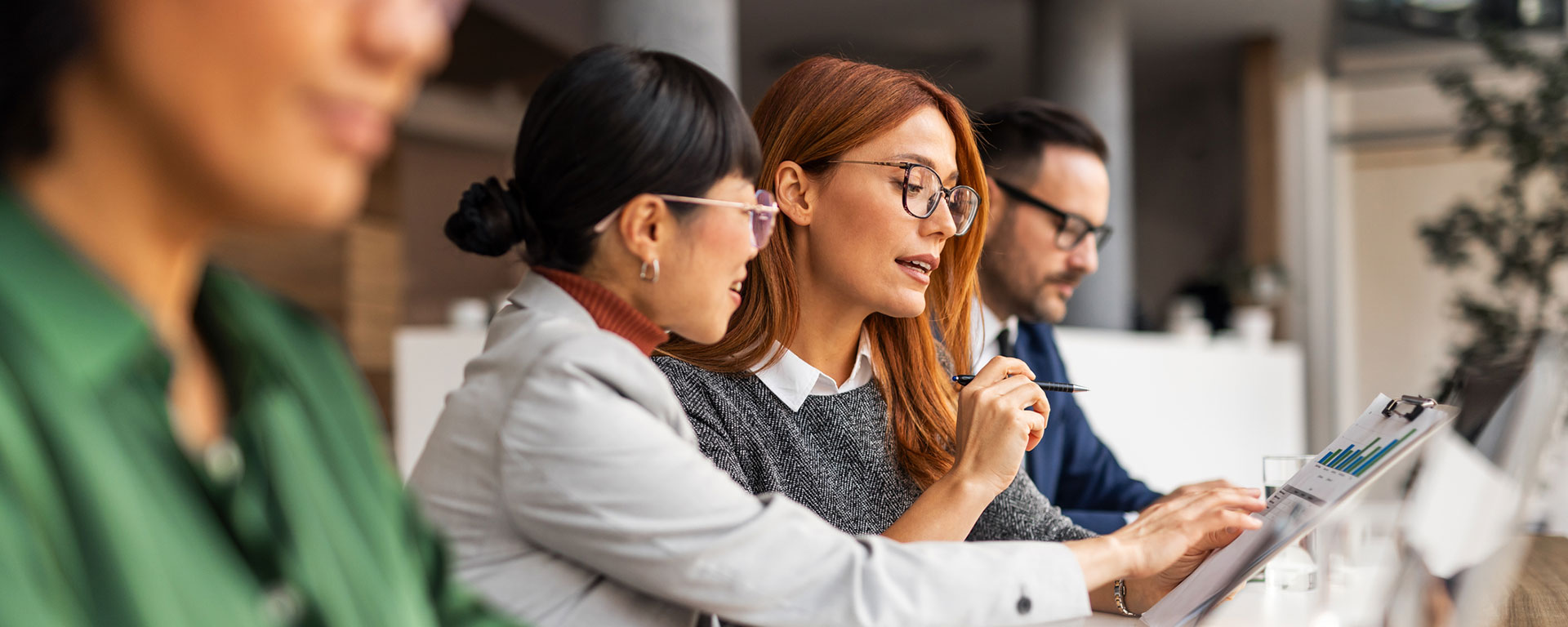 Scientists looking at a smart board