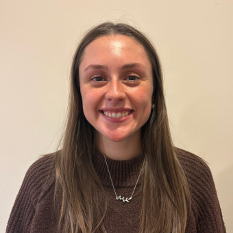 Tess Abboud smiling at the camera