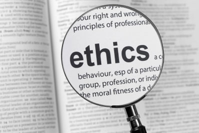 photo of magnifying glass highlighting the word ethics
