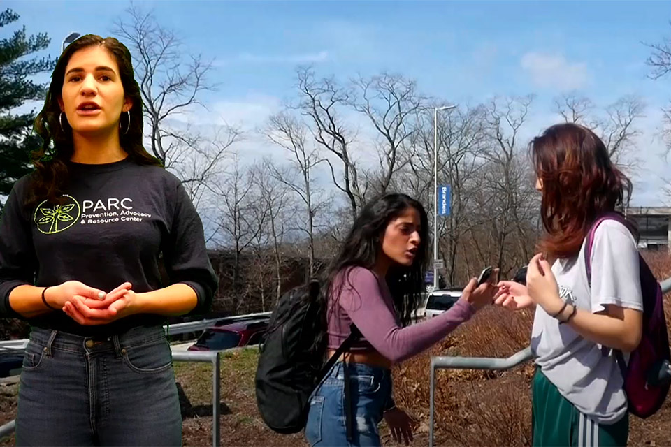 two female students arguing on steps while video narrator explains strategies for diffusing the rift