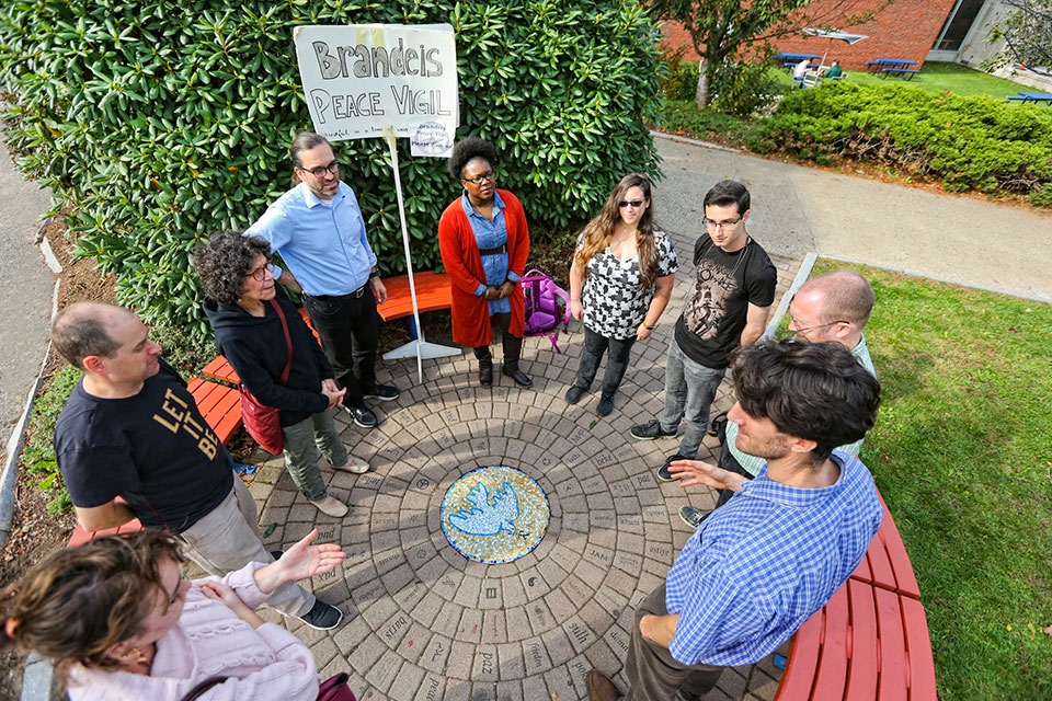 Students gather in a circle at the Peace Vigil