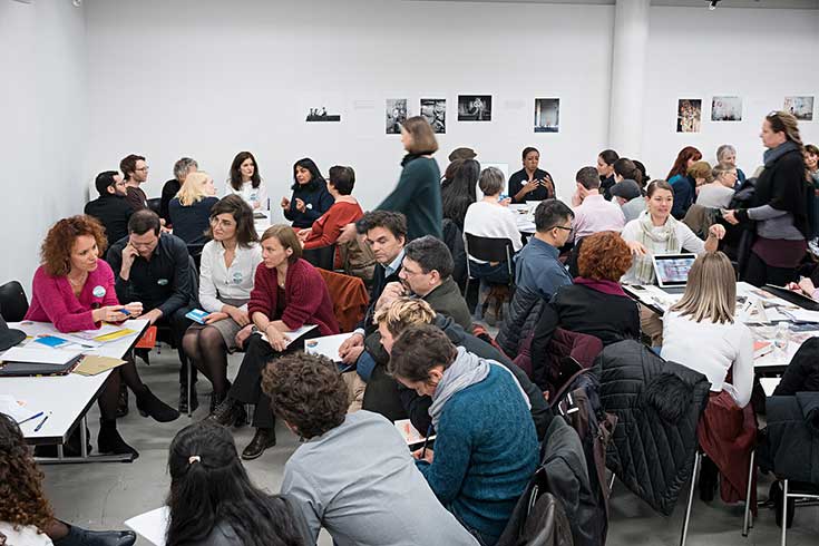 A group of people work together during a workshop